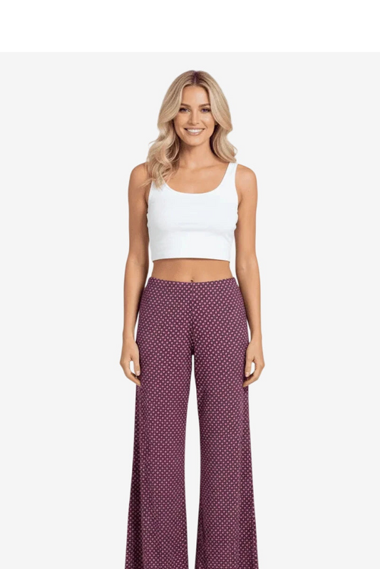 Pantaloni palazzo da donna rosa con stampa geometrica.