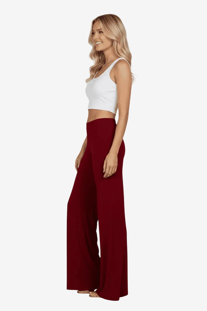 Pantalone lungo da donna color bordeaux con elastico in vita e vestibilità morbida.
